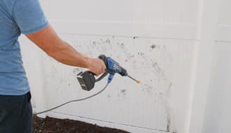 Turbo Jet® HydroX5® cleaning a fence